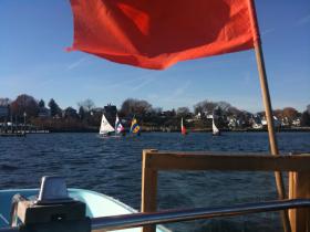 Skippers head for the leeward mark on the last race